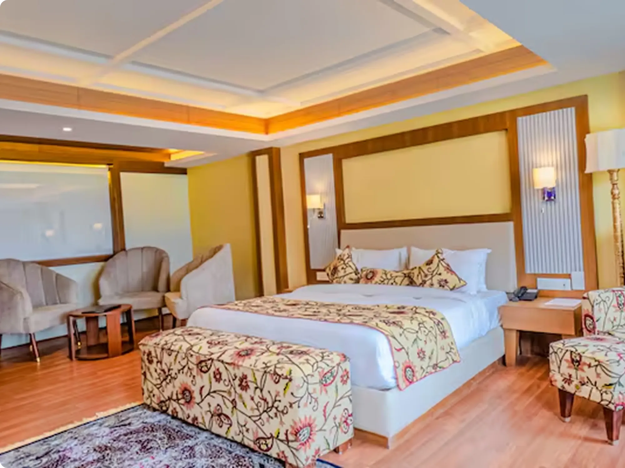 A 4-star hotel room with a Kashmiri embroidered bedspread
